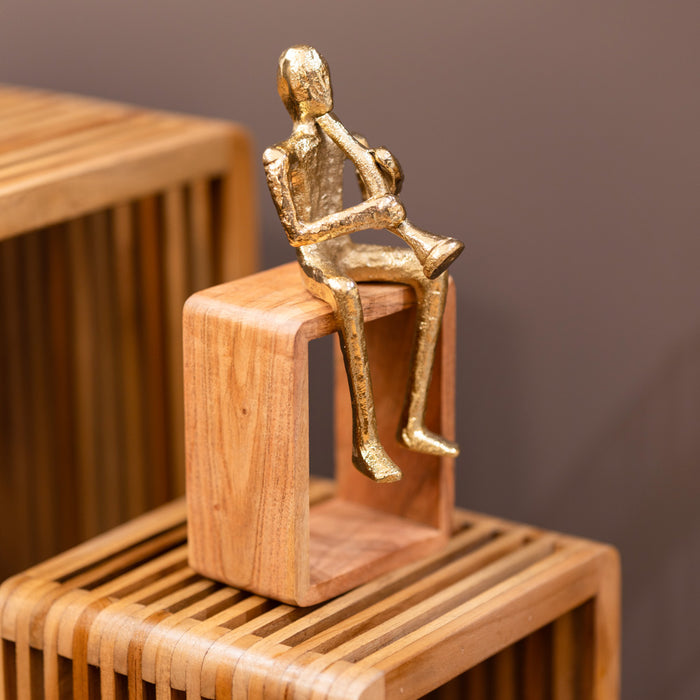 Sitting musician trumpet gold